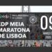 Um grande grupo de corredores atravessa uma ponte durante a Meia Maratona. O texto sobreposto diz: "EDP Meia Maratona de Lisboa", "Yoga Lounge" e a data "09 Março de 2025". Os logótipos da EDP e do evento estão presentes. | YogaLounge